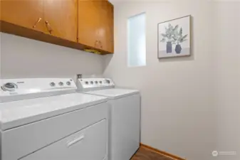 Laundry room has newer washer and dryer