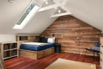 Bedroom on upper level is light and bright.