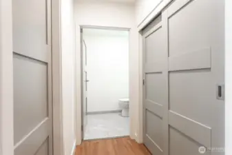 Hallway entry to half bathroom.