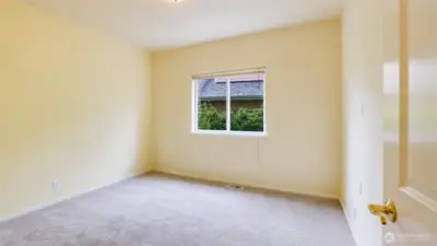Enjoy main floor living with this spacious guest bedroom - great for multi-gen living, home office, guest room, etc.