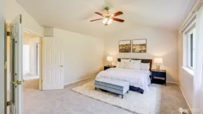 Enter the serene primary suite through stylish double doors that adds uniqueness to the space