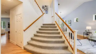 Step in with direct access to the grand extra-wide stairs, or head left or right into inviting living spaces