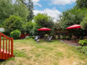 Established plantings surround the open lawn area. Space to host a big party.