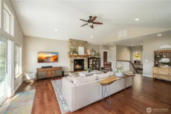 Imagine relaxing or entertaining with high ceilings, rich wood floors and the views beyond!