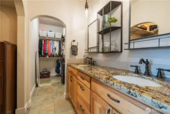Two closets, dual sinks and a large vanity.