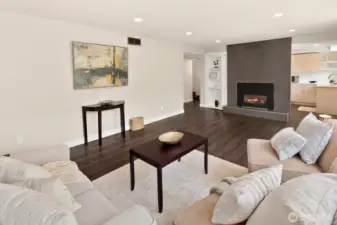 Lower recreation room with gas fireplace