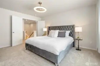 Expansive Primary Bedroom Featuring French Doors