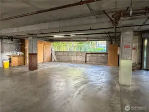 A great little work area to the right and 3 locked storage units are yours.