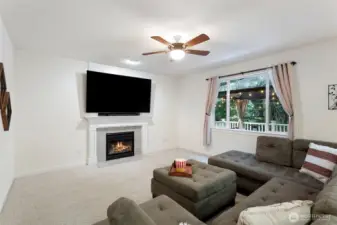 Large Family Room with gas fireplace. TV stays with home.