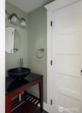 Powder bath near kitchen off utility room