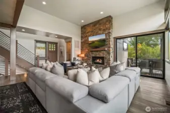 Head downstairs and you find another gathering area that leads out to a covered patio and a few steps from the hot tub - anyone want a soak?