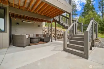 Covered all weather patio with electric heater and strand lights for the perfect evening "hang" spot
