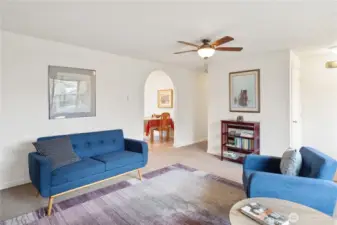 In this photo you can see the hall closet, hall to the bedrooms and baths and arched entry to the dining and kitchen area.