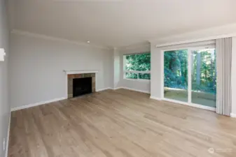 Living room with wood burning fireplace.