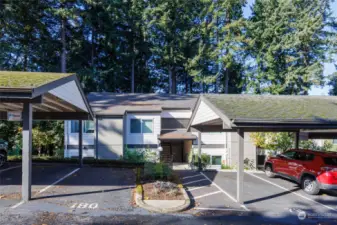 Ground floor corner unit with great access to the 2 dedicated parking spaces. The uncovered space and carport on the left side are for this unit.