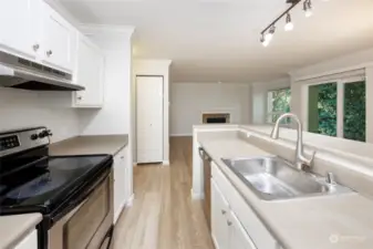 Updated kitchen with stainless appliances and new flooring and paint.