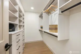 Massive walk in closet with designer built-in's.