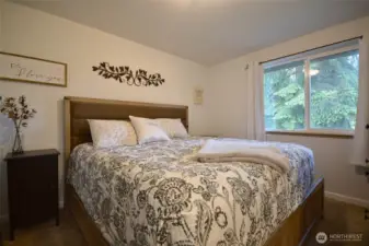 Primary bedroom has a king size bed and there is still plenty of room    with walk-in closet.