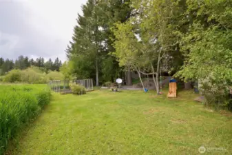 huge level area for playing, relaxing as you gaze into the meadow. This home is surrounded by nature, no homes can be built in the back or to the right of the property.