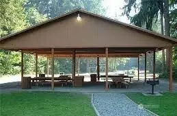 Cabanas ready for parties, BBQ's  equipped with picnic benches.