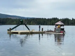 FUN IN THE SUN! Swim area has a Floating dock with the  slide for the kids and adults