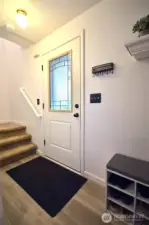 Entry way, this home has so much to offer new floors LVP, newer carpet, interior paint, new kitchen cabinets , quarts counter tops, pull outs in cabinets, newer appliances. Too many to list.