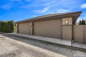 Oversized four car garage with flat alley access.
