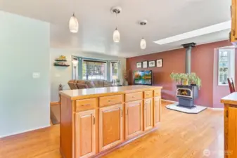 Warmth & Function – Kitchen Island Meets Cozy Wood Stove Comfort