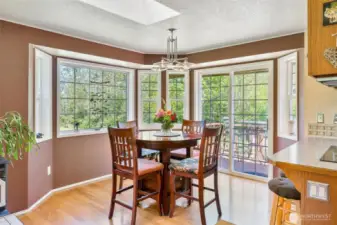Dining room with ample lighting and access to the backyard deck.