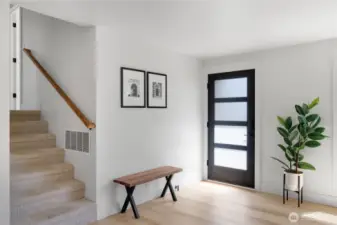 Entry way from front door with stairs to the bedrooms shown on left.