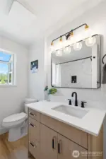 Main Bath, fully remodeled with a modern look and high quality finishes.