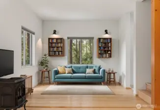 Stairs to upper floor seen here. This living room is virtually staged.