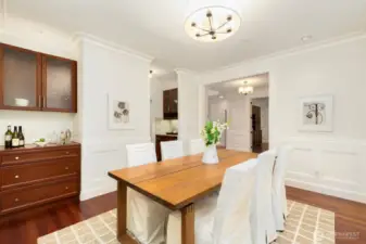 Note the wet bar area to the left - and the additional wet bar pictured in the top center of the photo. That space leads to the kitchen. There you'll also find the walk-in pantry in the same area leading to the kitchen.