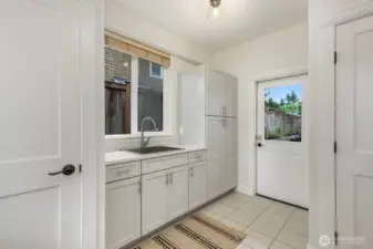 On the other side of the kitchen, the remodeled mudroom sits, as well as utility closets.