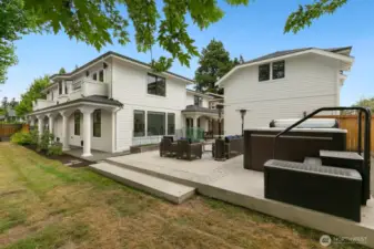 Looking back towards the house from the fully fenced in yard. The detached 3-car garage is to the right and the DADU sits on top!