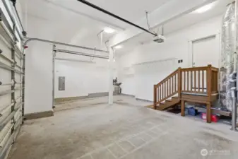 Full 3 car garage with high ceilings, tankless water heater, high-end furnace, updated garage door opener.