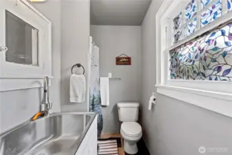 Crisp and cute .75 bath, on the main floor of the 1928 Tudor.