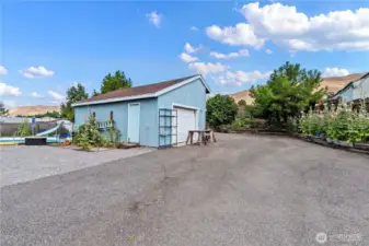 The garage off the 1928 Tudor home has been resided and re-roofed from the original.