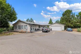 The 1997 Marlette manufactured home has been lovingly maintained with 3 beds, two full baths, and its own detached two car garage and shop.