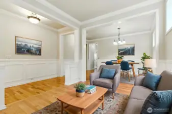 This virtually staged formal living room is located just off the front entry, creating a welcoming first impression. It flows seamlessly into the formal dining space, offering an elegant setting for entertaining and special gatherings.