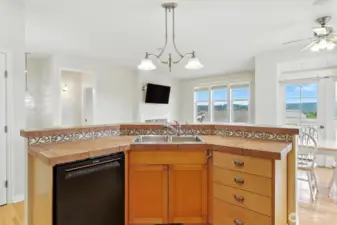This open-concept kitchen is designed to be the heart of the home, offering both functionality and stunning views