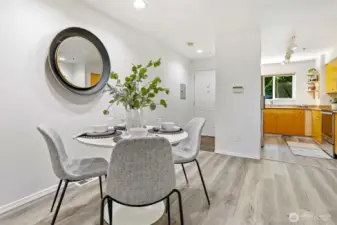 Dining area with new Luxury Vinal Plank flooring.  New paint in this room as well.
