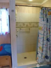 Tiled shower in primary bath.