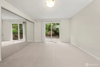 Primary Bedroom View of Closet & Slider