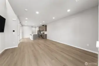 Open the front door and enjoy the nice sized family room that easily flows into the kitchen- all with clean lines and LVP flooring.