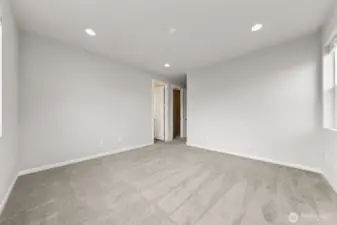 Primary suite - attached 3/4 bathroom, XL walk-in closet & recessed lighting.