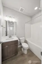 Main upstairs hallway full bathroom with LVP flooring.