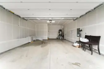 Two car garage with small shop space + garage door opener
