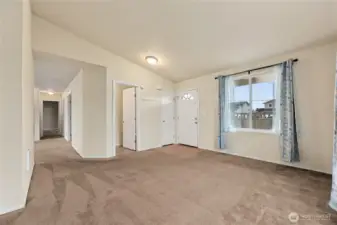 Enter into the front living room with half bath.