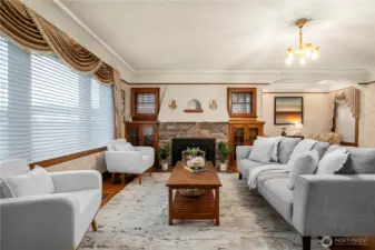 Main living space off the entry w/grand fireplace surrounded by custom built-ins
